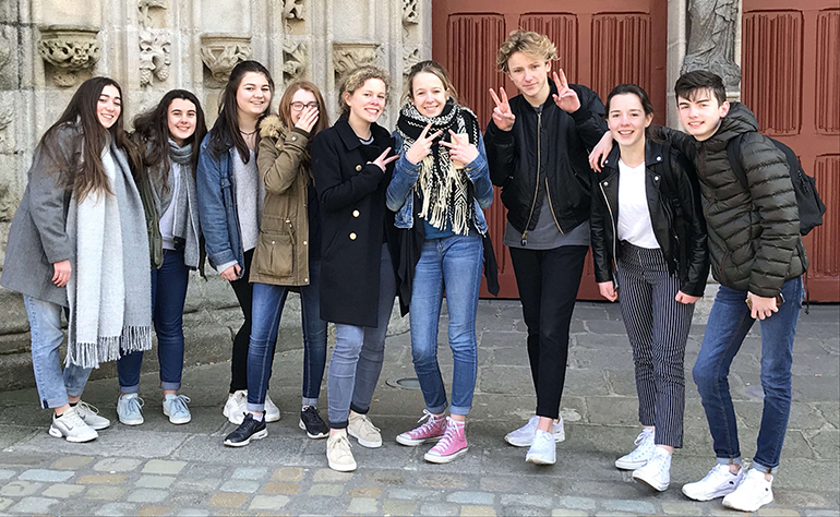 Greenheart Traveler Ian pictured with friends in France.